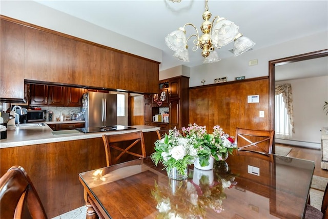 8 Sturbridge Ave, Smithfield, RI 02828 - dining space with a chandelier and baseboard heating