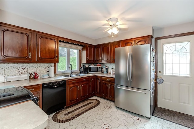 8 Sturbridge Ave, Smithfield, RI 02828 - kitchen featuring appliances with stainless steel finishes, light countertops, a ceiling fan, and tasteful backsplash