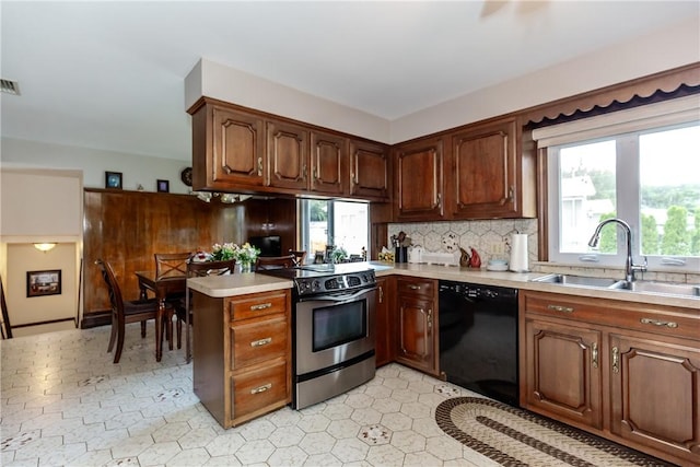 8 Sturbridge Ave, Smithfield, RI 02828 - kitchen featuring stainless steel range with electric cooktop, black dishwasher, light countertops, backsplash, and a peninsula