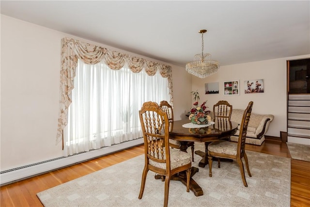 8 Sturbridge Ave, Smithfield, RI 02828 - dining room with a baseboard radiator, a chandelier, and wood finished floors