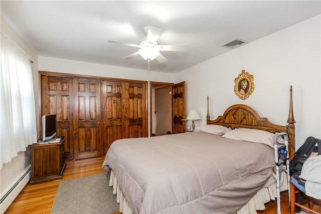 8 Sturbridge Ave, Smithfield, RI 02828 - bedroom with a baseboard heating unit, light wood-style floors, and ceiling fan