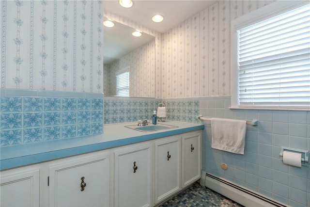 8 Sturbridge Ave, Smithfield, RI 02828 - bathroom featuring a baseboard heating unit, vanity, tile walls, wallpapered walls, and recessed lighting