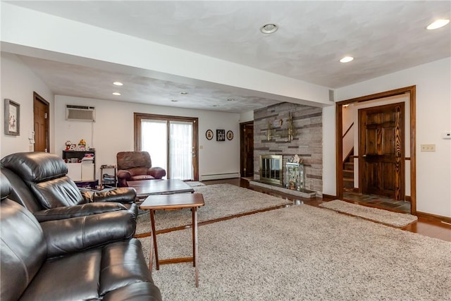 8 Sturbridge Ave, Smithfield, RI 02828 - living room with wood finished floors, recessed lighting, a fireplace, an AC wall unit, and a baseboard radiator