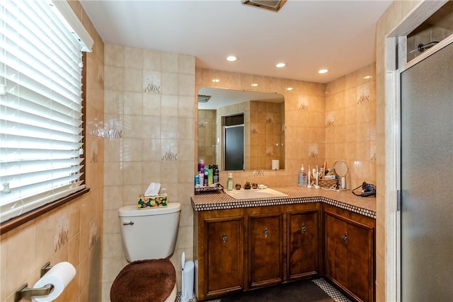 8 Sturbridge Ave, Smithfield, RI 02828 - bathroom with tile walls, vanity, a stall shower, and recessed lighting