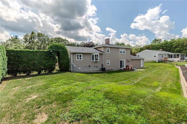 8 Sturbridge Ave, Smithfield, RI 02828 - rear view of property with a yard and a chimney