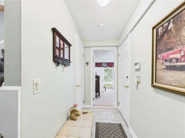 200 Cannon St Unit 130, Cranston, RI 02920 - doorway to outside with light tile patterned floors and a textured ceiling