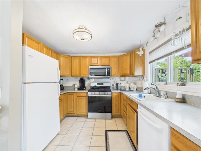 200 Cannon St Unit 130, Cranston, RI 02920 - kitchen with stainless steel appliances, light countertops, and light tile patterned flooring