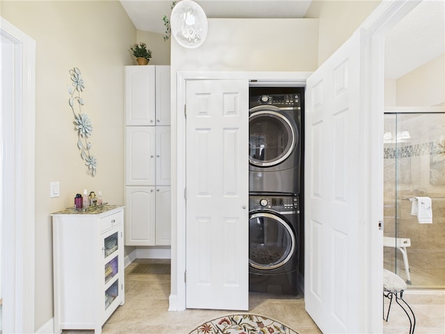 200 Cannon St Unit 130, Cranston, RI 02920 - washroom with stacked washer / drying machine and light tile patterned flooring