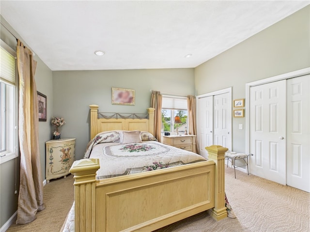 200 Cannon St Unit 130, Cranston, RI 02920 - bedroom with light colored carpet, lofted ceiling, and multiple closets