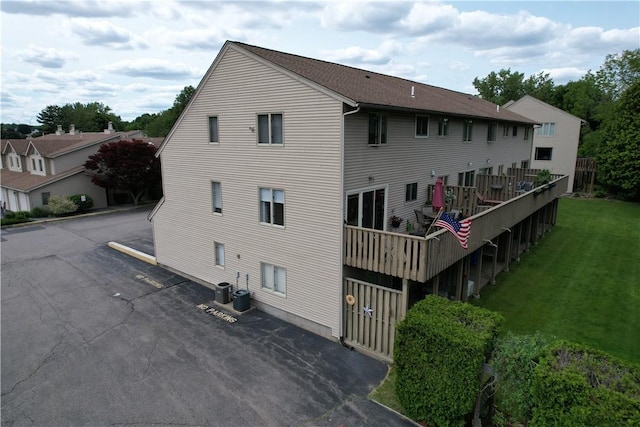 200 Cannon St Unit 130, Cranston, RI 02920 - back of house with uncovered parking and a yard