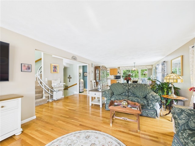 200 Cannon St Unit 130, Cranston, RI 02920 - living room featuring light wood-type flooring and stairs