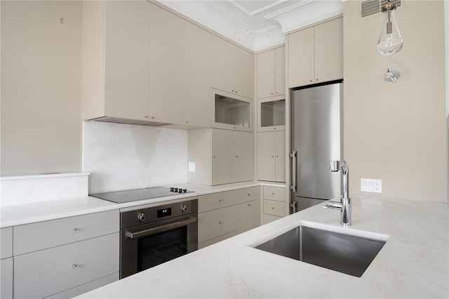 157 Waterman St Unit 2-5, Providence, RI 02906 - kitchen with stainless steel appliances, ornamental molding, light countertops, hanging light fixtures, and backsplash