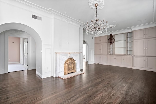 157 Waterman St Unit 2-5, Providence, RI 02906 - unfurnished living room featuring arched walkways, a chandelier, ornamental molding, and dark wood-style floors