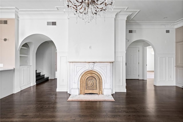 157 Waterman St Unit 2-5, Providence, RI 02906 - unfurnished living room with crown molding, wood finished floors, built in shelves, stairs, and a chandelier