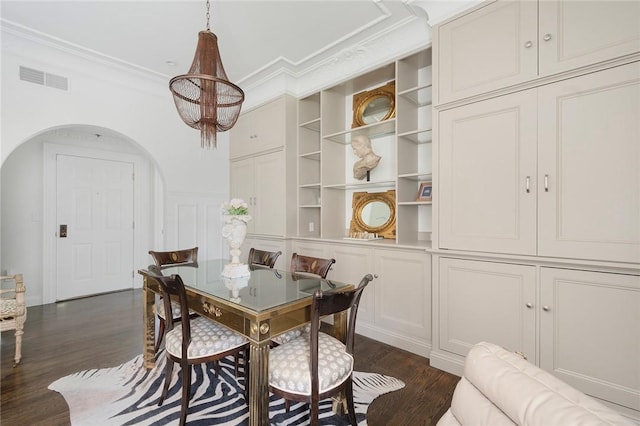 157 Waterman St Unit 2-5, Providence, RI 02906 - dining area featuring dark wood finished floors, arched walkways, ornamental molding, a chandelier, and a decorative wall