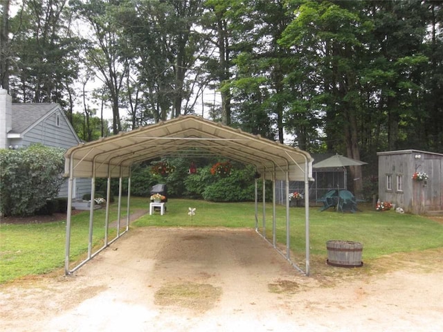 view of parking / parking lot with a carport and a yard