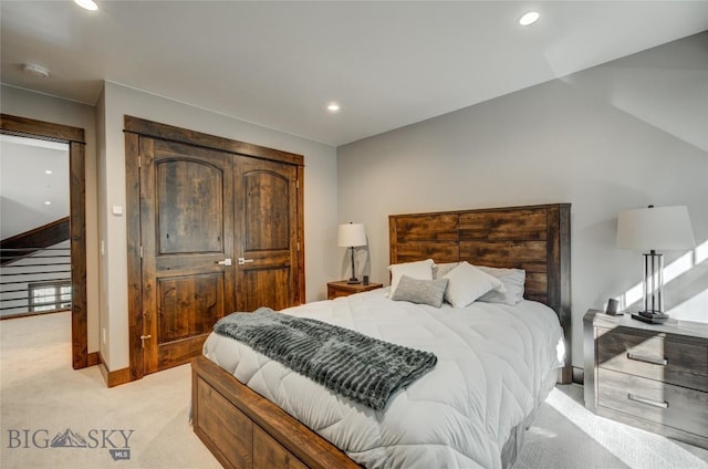 bedroom featuring light carpet