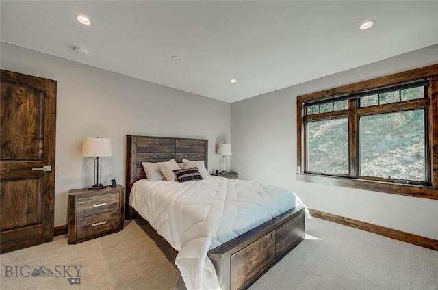 bedroom featuring light carpet