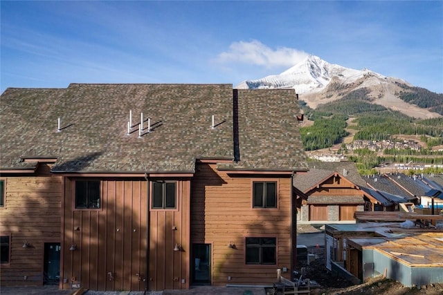 rear view of property featuring a mountain view