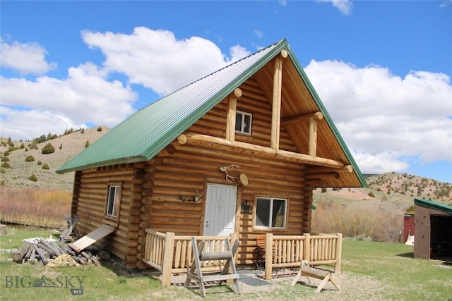 rear view of property with a mountain view