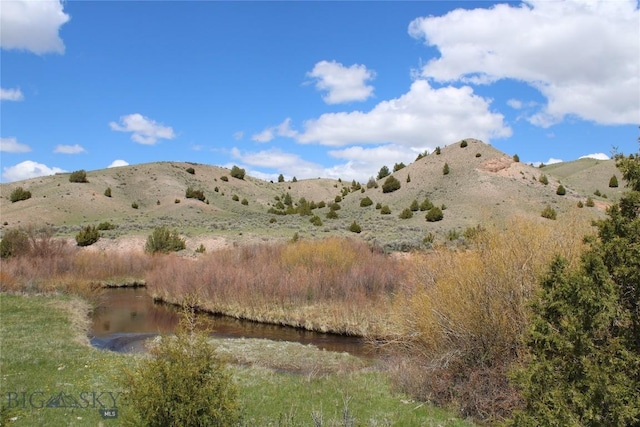 view of mountain feature featuring a water view