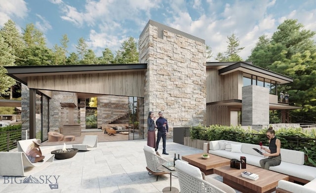 view of patio featuring an outdoor living space with a fireplace