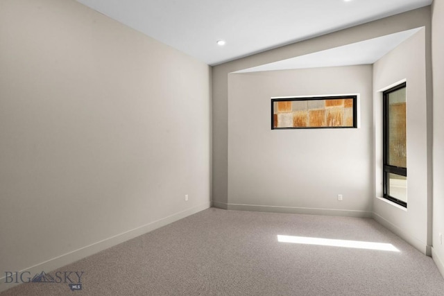 spare room with recessed lighting, carpet flooring, and baseboards