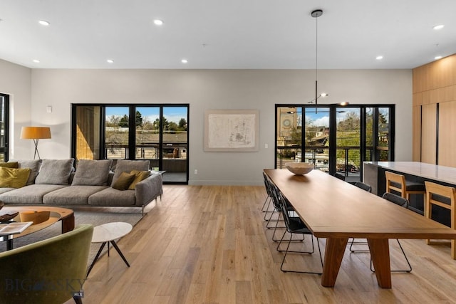 interior space featuring light wood-style floors, baseboards, and recessed lighting