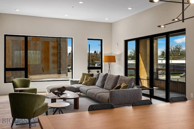 living area featuring wood finished floors and recessed lighting