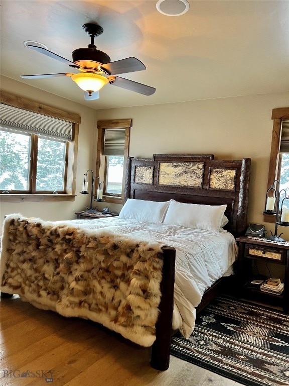 bedroom featuring ceiling fan and hardwood / wood-style flooring