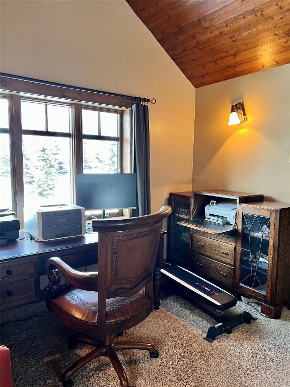 carpeted office featuring wooden ceiling and vaulted ceiling