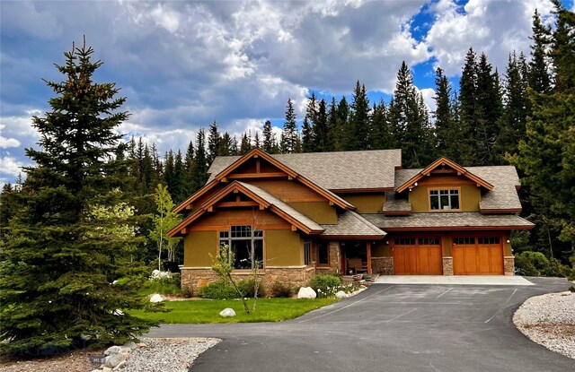 view of front facade with a front lawn and a garage