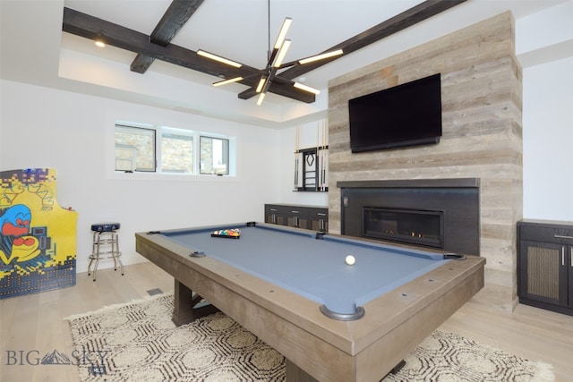 recreation room featuring beam ceiling, light hardwood / wood-style flooring, an inviting chandelier, and billiards