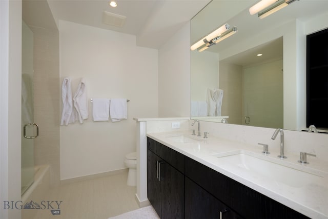 bathroom with vanity, toilet, and walk in shower