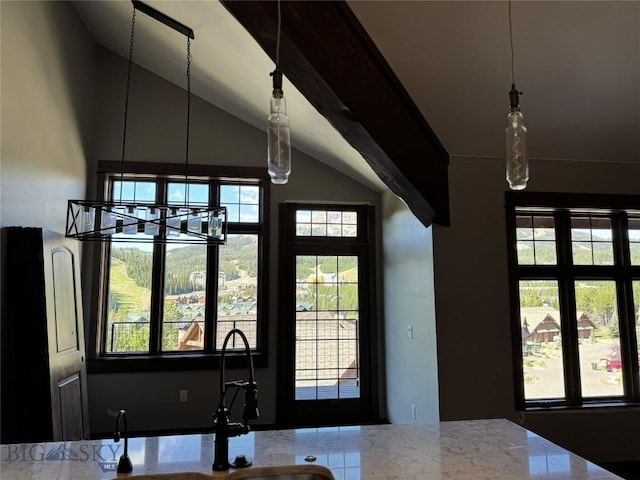 interior space featuring an inviting chandelier, sink, and vaulted ceiling