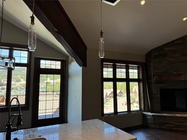 interior space featuring lofted ceiling, sink, and hardwood / wood-style floors