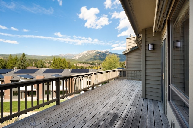 wooden deck featuring a mountain view