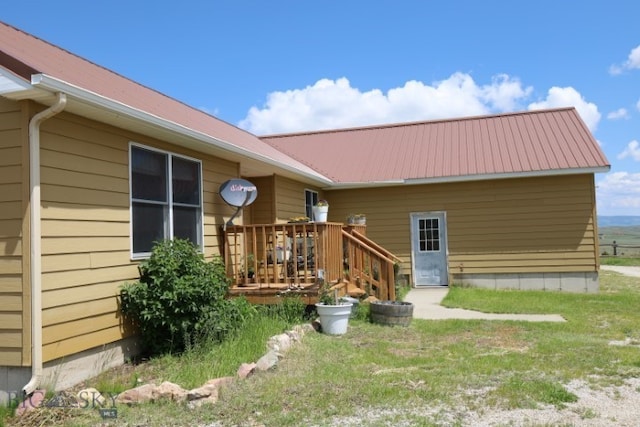 rear view of house with a deck