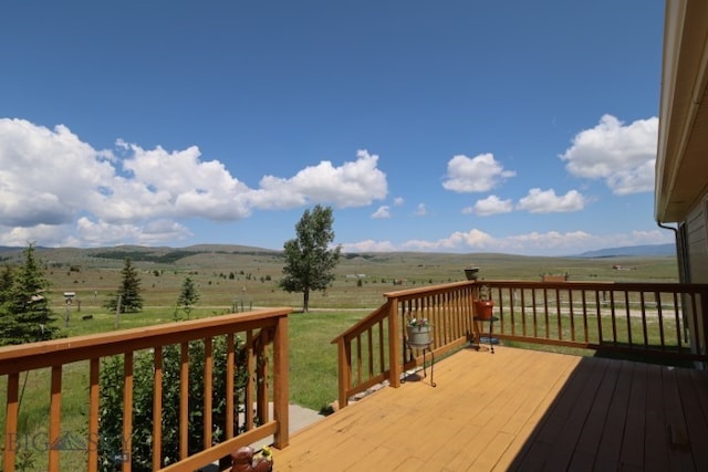 wooden terrace with a rural view