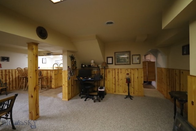 carpeted office space featuring ornate columns