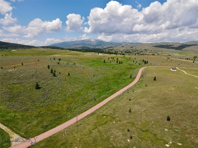 bird's eye view featuring a mountain view and a rural view