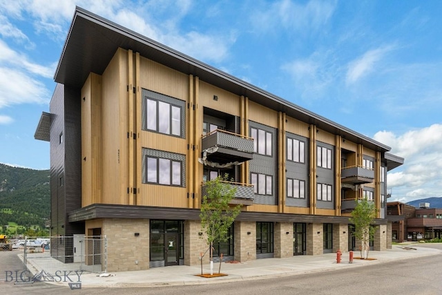 211 Town Center Ave Unit 2D, Big Sky, MT 59716 - view of building exterior with fence