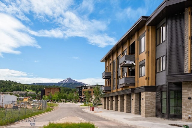 211 Town Center Ave Unit 2D, Big Sky, MT 59716 - view of asphalt street with a mountain view and curbs