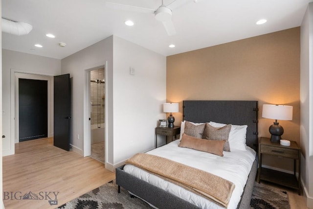 bedroom featuring ceiling fan, connected bathroom, and light hardwood / wood-style flooring