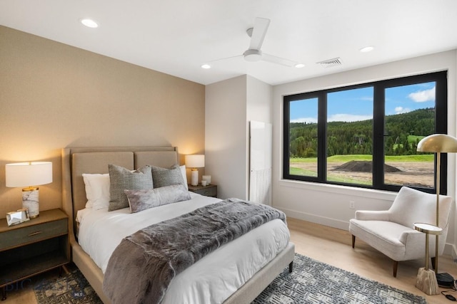 bedroom with hardwood / wood-style flooring and ceiling fan