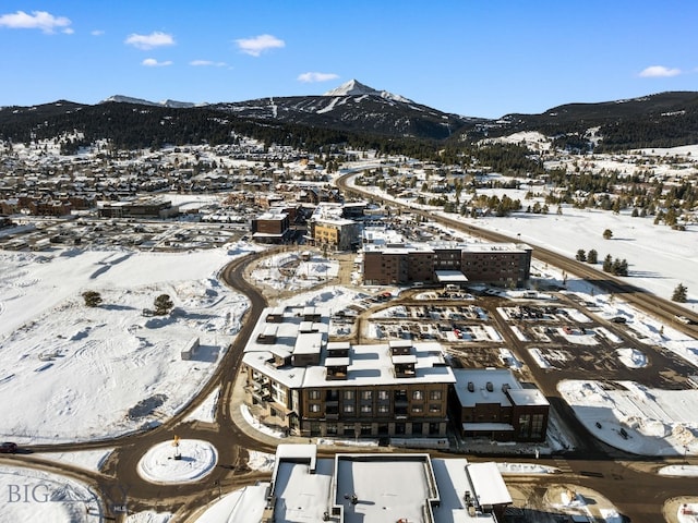 211 Town Center Ave Unit 2D, Big Sky, MT 59716 - snowy aerial view featuring a mountain view