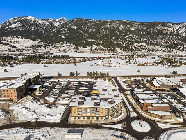 211 Town Center Ave Unit 2D, Big Sky, MT 59716 - snowy aerial view featuring a mountain view