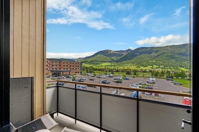 balcony featuring a mountain view