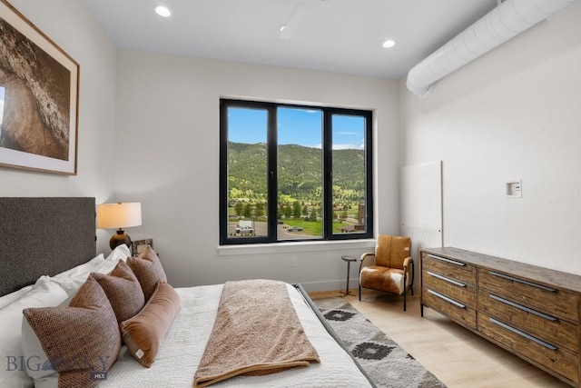 bedroom with light hardwood / wood-style flooring