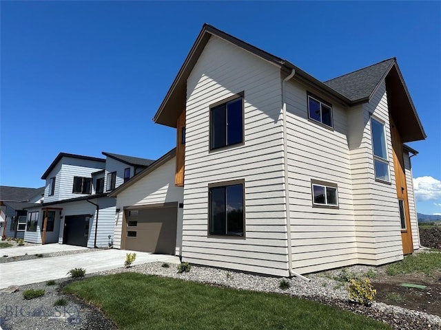 view of side of property with a garage